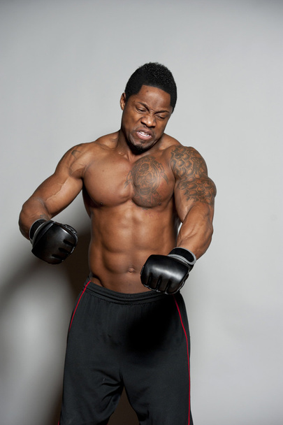 African American male boxing on Gray - Foto, imagen