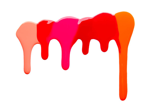 Spilled nail polishes on white background - Foto, afbeelding
