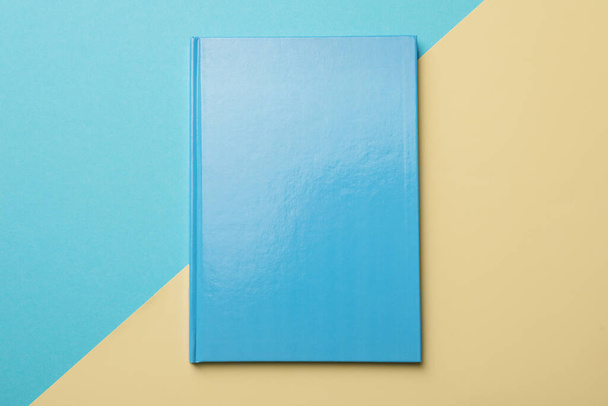 New light blue planner on color background, top view - Photo, image