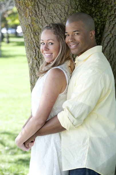 Young interracial couple in the park - Foto, Bild