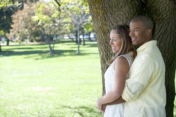 Young interracial couple in the park - Fotó, kép