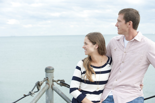 Young Caucasian couple at the pier - Φωτογραφία, εικόνα