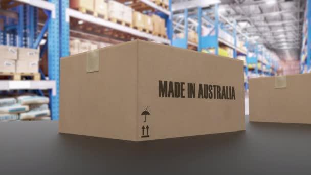 Pudełka z MADE W AUSTRALII tekst na przenośniku. Amerykańskie towary związane pętli animacji 3D - Materiał filmowy, wideo