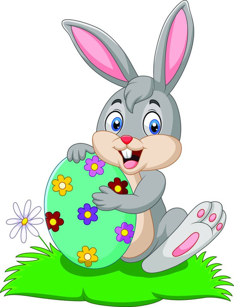 Cartoon bunny holding Easter egg - Vektor, kép
