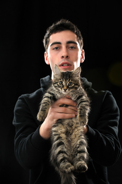 Young man with kitten - Photo, image