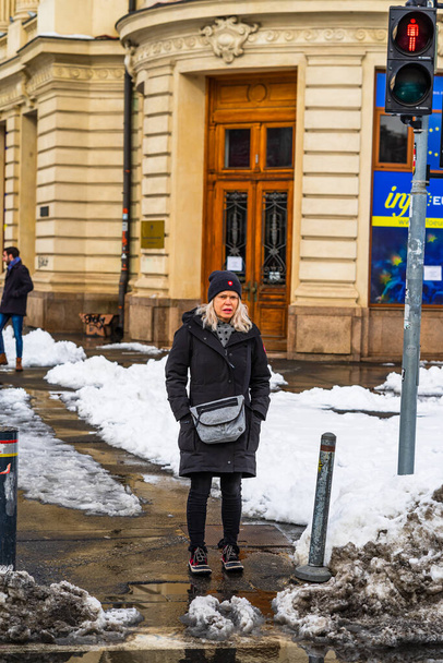 Waiting for taxi or bus on snowy road in Bucharest, Romania, 2021 - Foto, Imagen