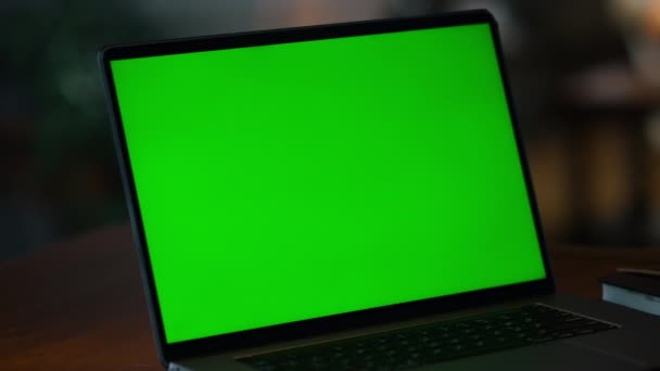 Closeup green screen laptop on table. Laptop computer with mockup display - Footage, Video