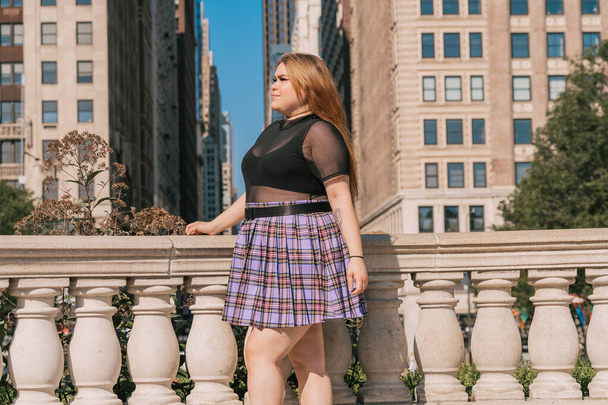 Trendy plus size woman in mini skirt - Photo, Image