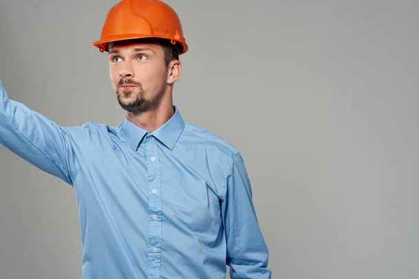 male builders Professional Job light background - Foto, Bild