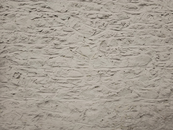 Concrete texture. Gray and raw plaster wall background. Coated concrete with scratches and rough texture in gray and white tones surface. - Photo, Image
