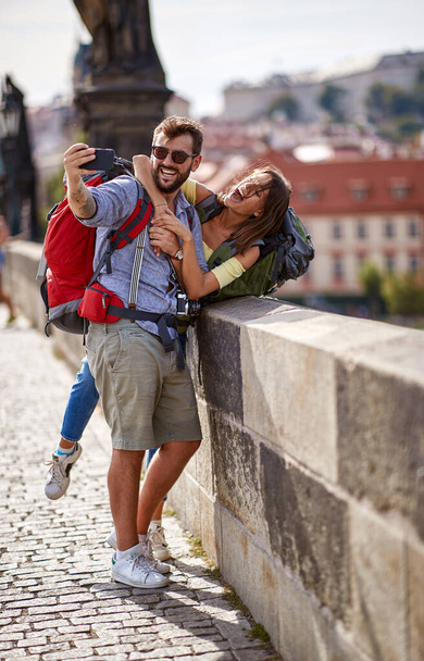 Tourist couple taking a selfie in Prague - Valokuva, kuva
