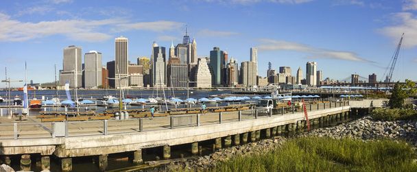 NEW YORK, UNITED STATES - Sep 19, 2017: The skyline of Lower Manhattan as seen from Brooklyn Bridge in the United States - Photo, Image