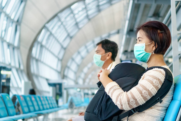 Νέος κανονικός τρόπος ζωής, Air ταξιδιώτες πρέπει να φορούν μάσκες για την προστασία covid-19 - Φωτογραφία, εικόνα