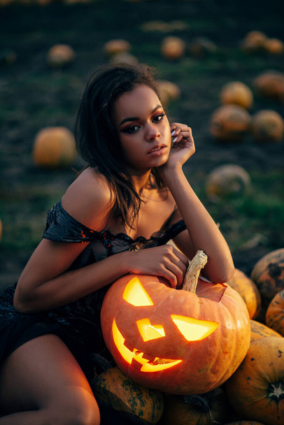 Mystical woman with pumpkin. - Zdjęcie, obraz