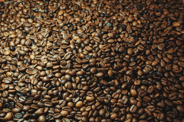 A pile of coffee beans texture background - Foto, Bild