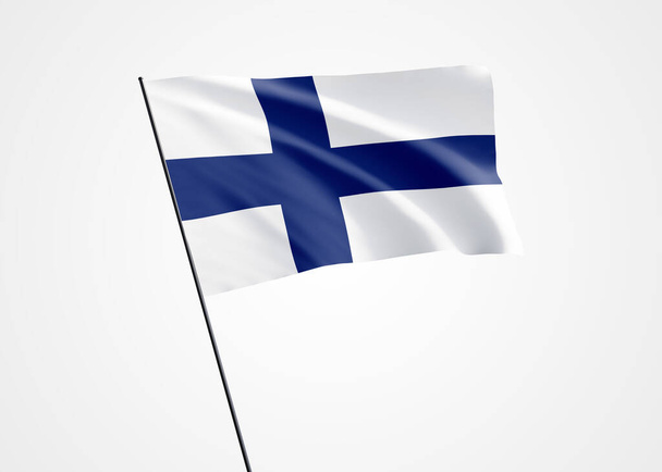 フィンランドの国旗は孤立した背景で高く飛んでいる。12月6日フィンランド独立記念日。世界国旗コレクション世界国旗コレクション - 写真・画像