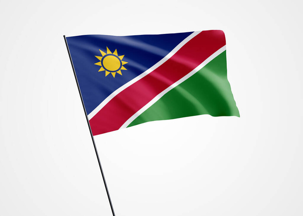 Bandera de Namibia ondeando alto en el fondo blanco aislado. 21 de marzo Día de la Independencia de Namibia. Colección mundial de bandera nacional Colección mundial de bandera nacional - Foto, imagen
