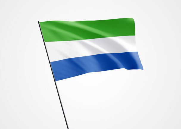 Bandera de Sierra Leona ondeando alto en el fondo blanco aislado. 27 de abril Día de la Independencia de Sierra Leona. Colección mundial de bandera nacional Colección mundial de bandera nacional - Foto, imagen