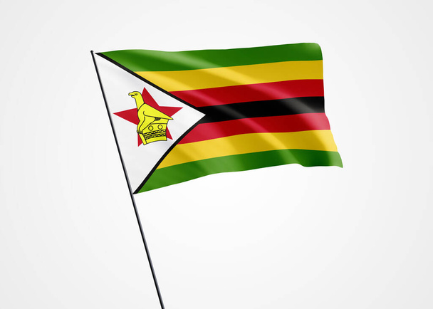 Bandera de Zimbabue ondeando alto en el fondo blanco aislado. 18 de abril Día de la independencia de Zimbabue. Colección mundial de bandera nacional Colección mundial de bandera nacional - Foto, imagen