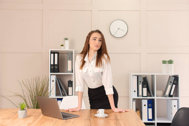 beautiful young businesswoman works at the computer in the office. freelance remote work - 写真・画像