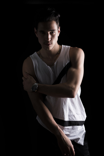 Portrait of handsome young man in white tank-top - Photo, image