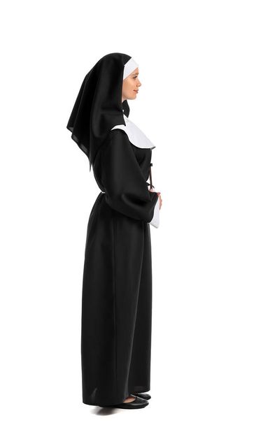 Young nun on white background - 写真・画像