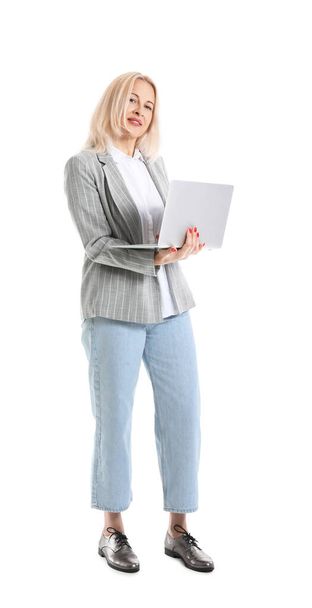 Mature businesswoman with laptop on white background - 写真・画像