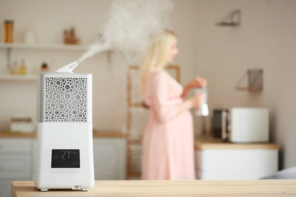 Modern humidifier at table in kitchen - Photo, Image