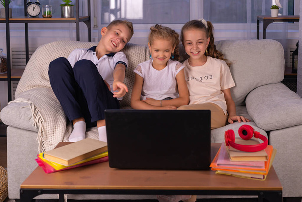happy family together. brother and two sisters play at home. home schooling concept - Foto, Imagem