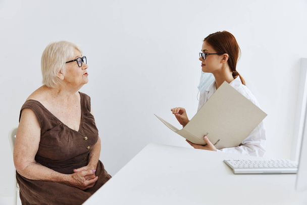 elderly woman with glasses examination by a doctor doctor assistant - Photo, Image