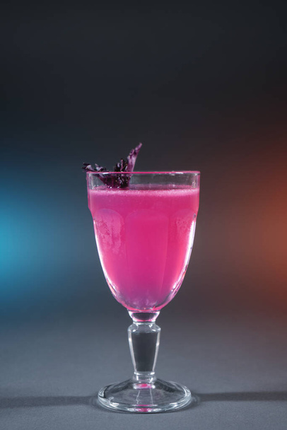 luxury alcohol pink cocktail drink with basil in glass on grey background - Valokuva, kuva