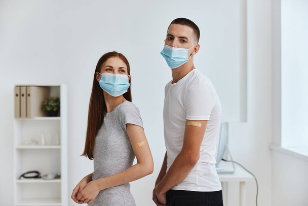 young couple in hospital covid vaccination passport immunity protection - Photo, Image