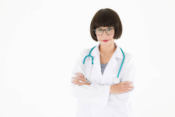 Confident young Asian female medic in glasses with stethoscope looking at camera friendly against white background - Foto, Imagen