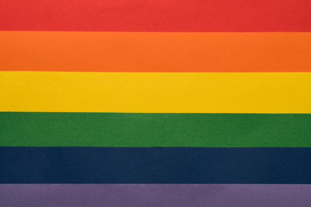 A closeup of colorful paper on each other like the pride flag - Фото, зображення