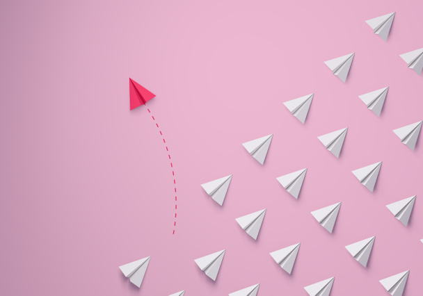 Individuele en unieke leider roze papieren vliegtuig van richting veranderen. Individualiteit Leiderschap van vrouwen. 3d destructie. - Foto, afbeelding