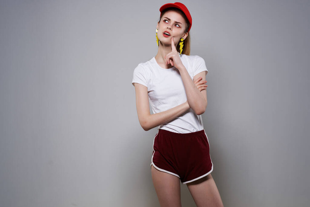 girl in red cap yellow blocking earrings fashion summer - Foto, Bild