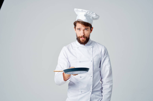 chefs with a frying pan cooking food restaurant kitchen emotions - Photo, Image
