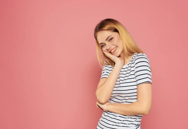 beautiful woman in a striped T-shirt fun hand gestures emotions - Фото, изображение