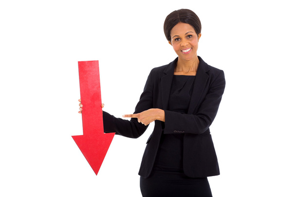mature african businesswoman holding red arrow - Foto, imagen