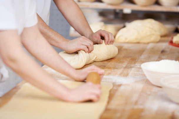 Chefs preparing dough for bread - Foto, imagen