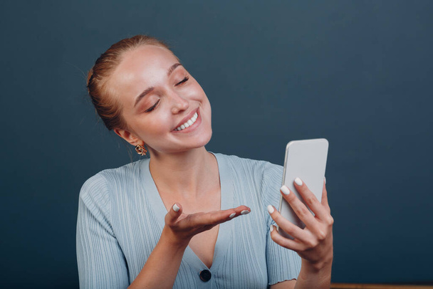 Adult young woman smile portrait in studio mobile phone - Foto, Imagen