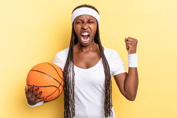 shouting aggressively with an angry expression or with fists clenched celebrating success. basket concept - Photo, image