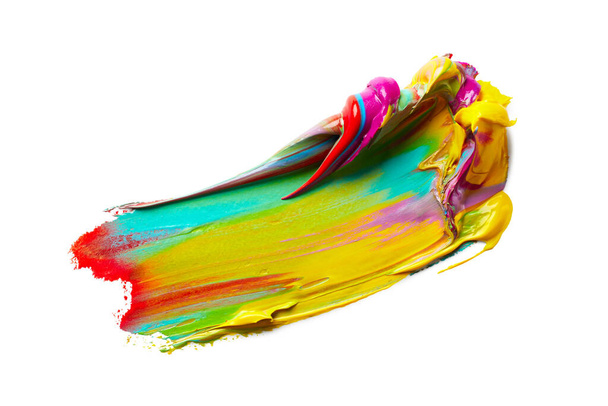 Yellow paint stroke with mixed colors over white background - Foto, afbeelding