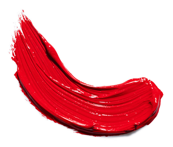 Ярко-красный штрих краски на изолированном белом фоне - Фото, изображение