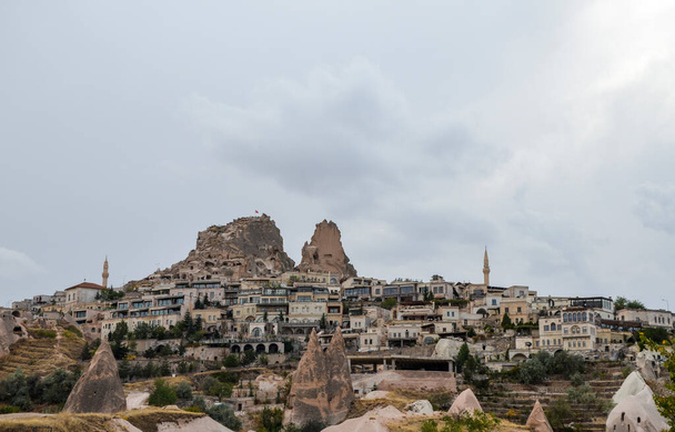 The town of Uchisar with highest building of Cappadocia the Castle Rock, Turkey - Fotó, kép