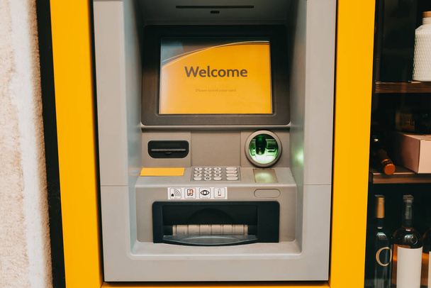 ATM machine, close-up. Automated teller machine built into the building facade. - Foto, afbeelding