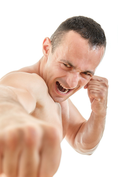 Primer plano retrato de boxeador de kick boxer puñetazos con expresión
 - Foto, Imagen