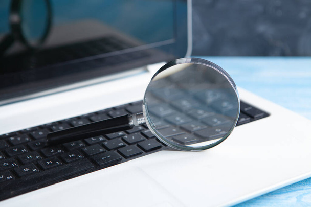 magnifier on laptop. web search concept - Foto, afbeelding