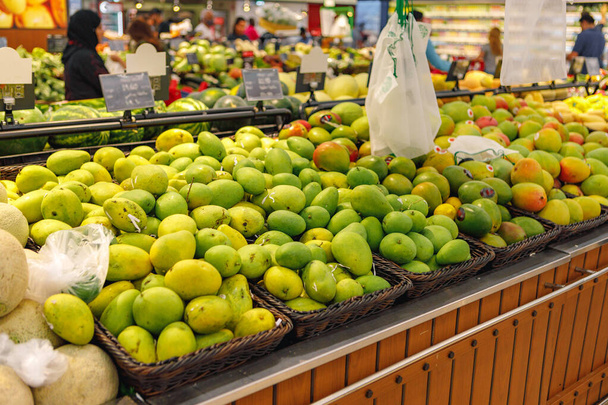 Assortment of fresh fruits on counter in supermarket - Foto, Imagen