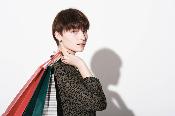 Young woman with shopping bags - 写真・画像